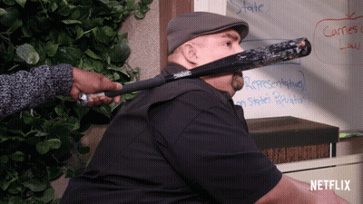Man With Bat In Mouth Netflix Logo GIF