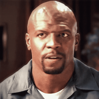 Man With Beard And Bald Head Looking At Camera GIF