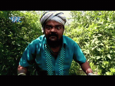 Man With Beard And Bandaged Headband Standing In Woods GIF