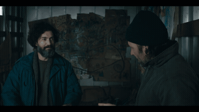 Man With Beard And Beanie Talking To Another Man GIF