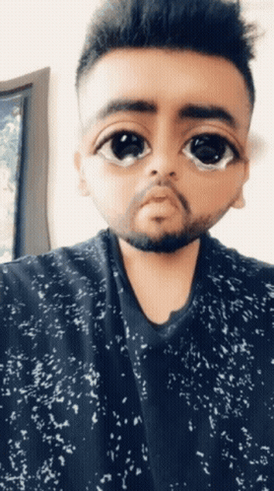 Man With Beard And Big Eyes In Black And White Shirt GIF