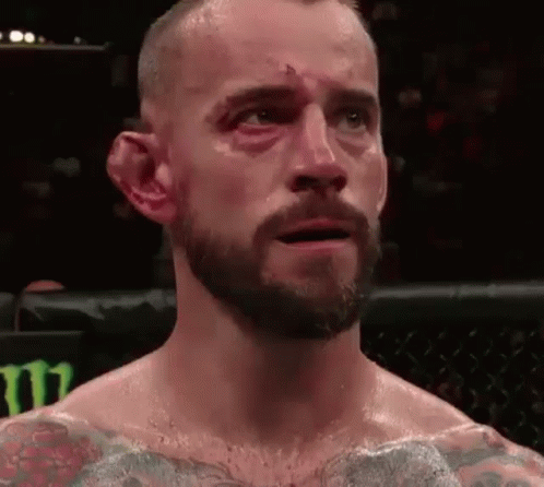 Man With Beard And Black Eye In Boxing Ring Eyes Closed GIF