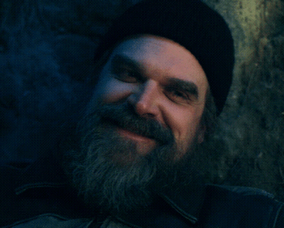 Man With Beard And Black Hat Looking At Camera GIF