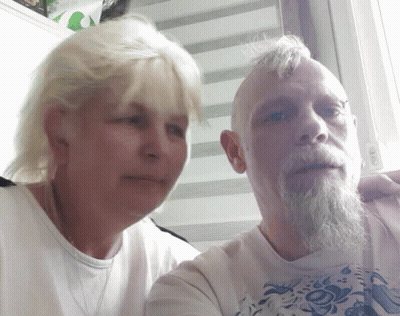 Man With Beard And Blonde Woman Posing GIF