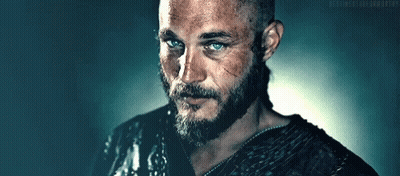 Man With Beard And Blue Eyes Next To Ponytail Man GIF