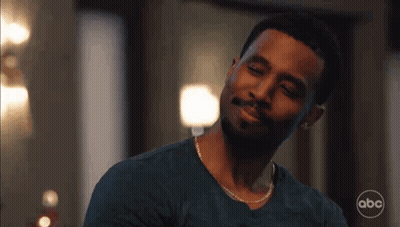 Man With Beard And Chain Smiling At Camera GIF