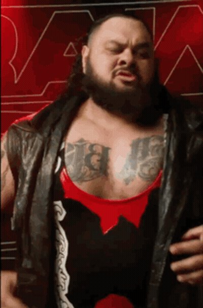 Man With Beard And Chest Tattoos Wearing Black Leather Vest GIF
