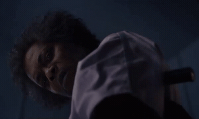 Man With Beard And Curly Hair Holding Knife GIF