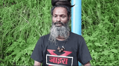 Man With Beard And Dreadlocks In Black T-Shirt And Blue Pole GIF