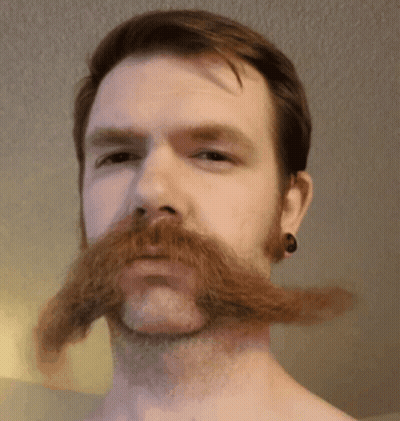 Man With Beard And Ear Plugs GIF