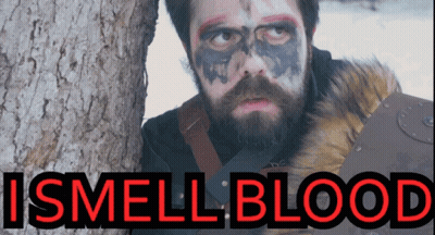 Man With Beard And Face Paint Next To Tree Saying I Smell Blood GIF