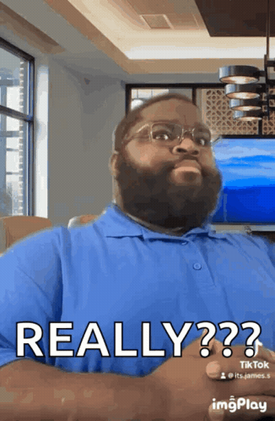 Man With Beard And Glasses In Blue Shirt Saying Really GIF