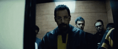 Man With Beard And Glasses In Elevator With Other Men GIF