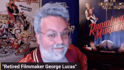 Man With Beard And Glasses In Front Of Radioland Murder Poster GIF