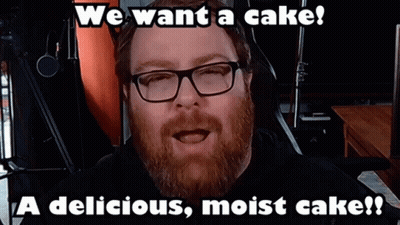 Man With Beard And Glasses Says We Want A Cake A Delicious Moist Cake GIF