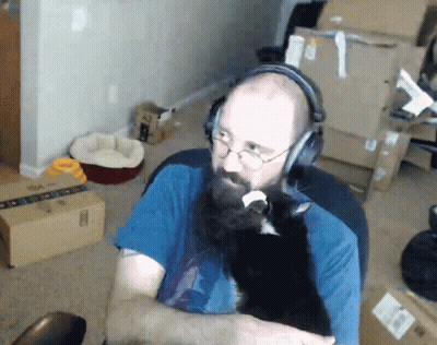 Man With Beard And Glasses Touching Chin GIF