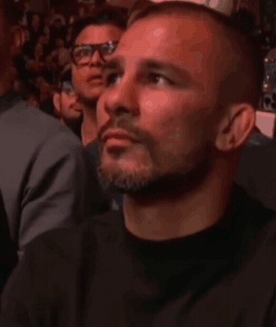 Man With Beard And Glasses Watching Fight GIF