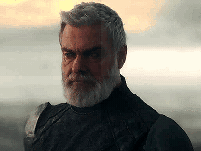 Man With Beard And Gray Hair Standing By Water GIF