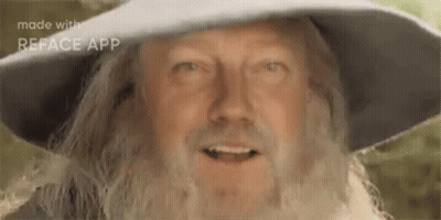 Man With Beard and Hat Smiling at Camera