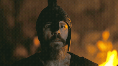 Man With Beard And Helmet Before Burning Fire GIF