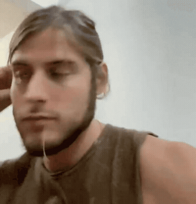 Man With Beard And Helmet Looking At Camera GIF