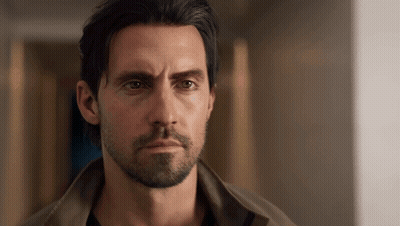 Man With Beard And Long Hair Looking At Camera GIF