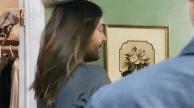 Man With Beard And Long Hair Standing Next To Woman With Long Hair GIF