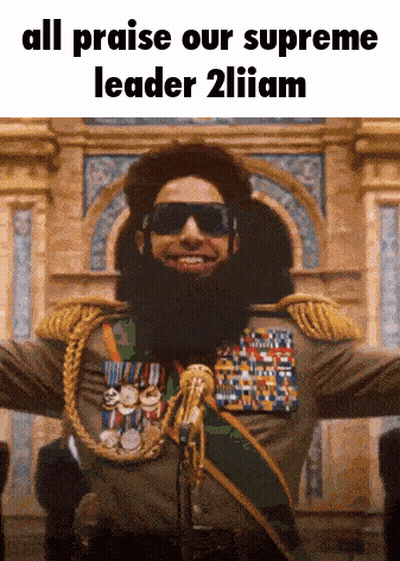 Man With Beard And Medals Saying All Praise Our Supreme Leader GIF