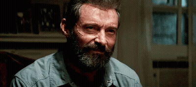 Man With Beard And Mustache In Blue Shirt Sitting In Chair GIF