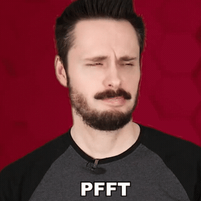 Man With Beard And Mustache In Gray Shirt Saying Pfft GIF