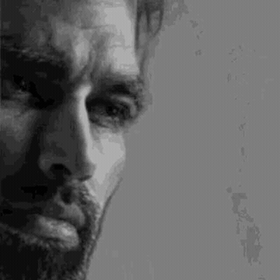 Man With Beard And Mustache Looking Down GIF