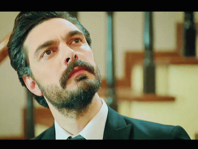 Man With Beard And Mustache Looking Up GIF