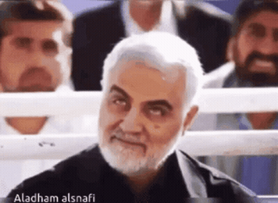 Man With Beard And Mustache Smiling In Crowd GIF