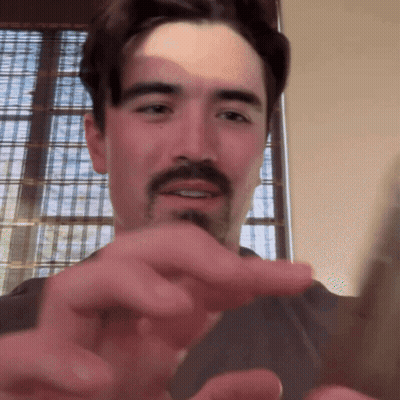 Man With Beard And Mustache Smiling Pointing GIF