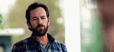 Man With Beard And Plaid Shirt Looking At Camera GIF