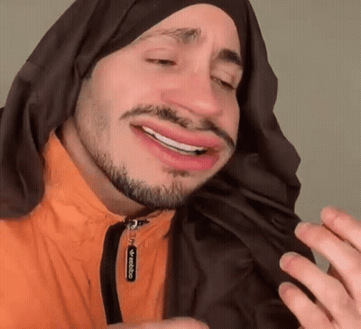 Man With Beard And Scarf Making Face GIF