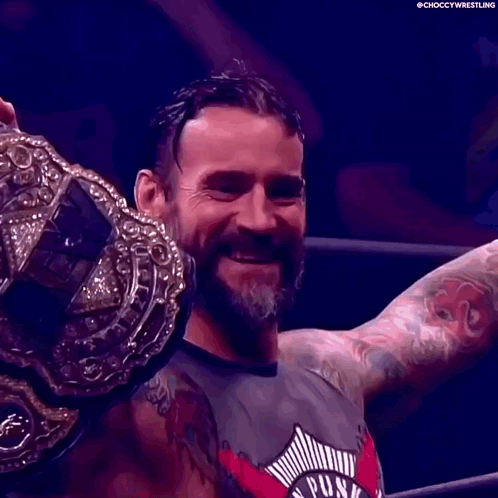 Man With Beard And Tattoos Holding Wrestling Championship Belt GIF