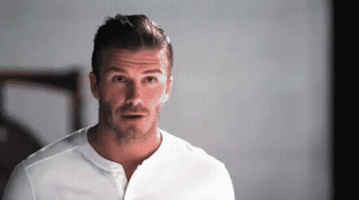 Man With Beard And White Shirt Making Funny Face GIF