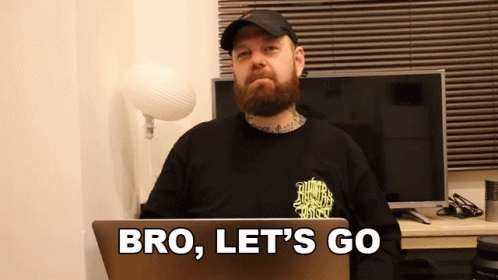 Man With Beard At Laptop Saying Bro Let's Go GIF