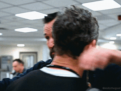 Man With Beard Being Hugged By Another Man GIF