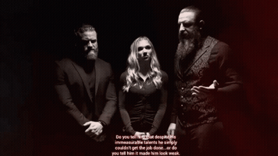 Man With Beard Beside Woman In Black Dress GIF