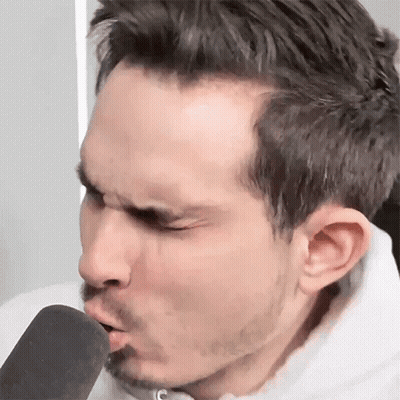 Man With Beard Blowing Into Microphone GIF