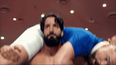 Man With Beard Carried By Man In Blue Shirt GIF