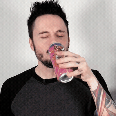 Man With Beard Drinking From Pink Can GIF