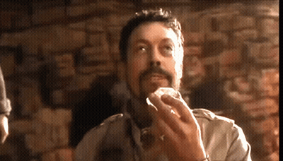 Man With Beard Eating At Stone Wall GIF