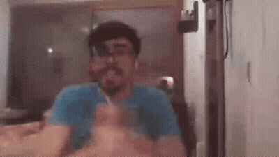 Man With Beard Eating Food At Table GIF