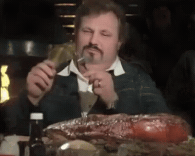 Man With Beard Eating Large Meat GIF
