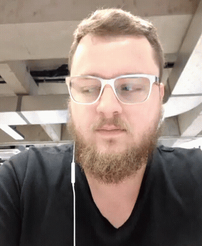 Man With Beard Glasses And Ear Buds GIF