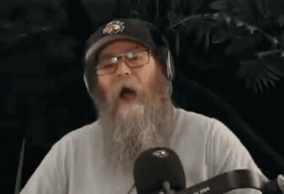 Man With Beard Glasses Headphones Singing Into Mic GIF