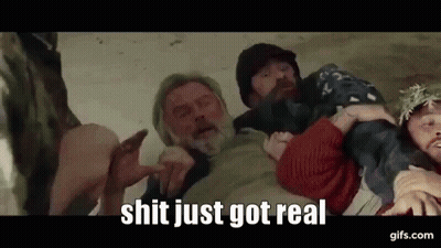 Man With Beard Held By Group Of People GIF
